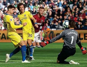  ?? AP ?? Facing up: Morata’s chip hits keeper Fabianski square in the face