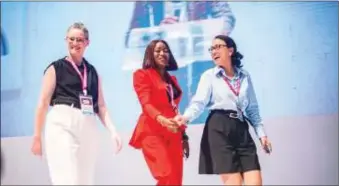  ?? ?? Bimpe Akingba (m) flanked by Elizabeth Lusk (l) and Lindsay Kalbfleisc­h of Greo