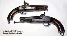 ??  ?? A pair of 19th century Tower flintlock pistols