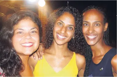  ??  ?? From left: Israeli tourists Adi Silberman and Shahar Harazi met Dina Giller Avraham, an Ethiopian Jew living in Jamaica, for the first time on Wednesday, May 18.