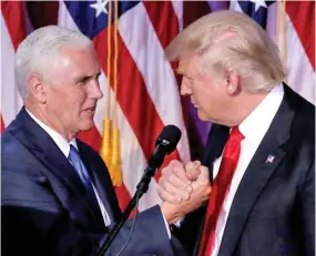  ??  ?? U.S. President-elect Donald Trump and Vice President-elect Mike Pence (left).