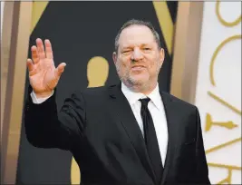  ?? By Jordan Strauss ?? The Associated Press Harvey Weinstein arrives at the Oscars in 2014 in Los Angeles. Weinstein is taking a leave of absence from his company after a report alleged decades of sexual harassment against women, including employees and actress Ashley Judd.