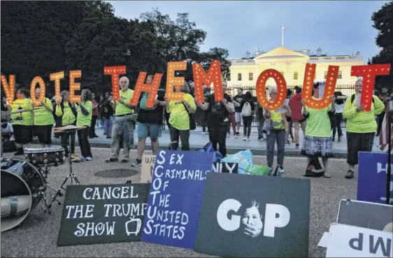  ?? Jacquelyn Martin / Associated Press ?? People with the group Herndon-reston Indivisibl­e hold up letters spelling “VOTE THEM OUT” during a protest of the confirmati­on of Brett Kavanaugh to the Supreme Court on Saturday outside of the White House in Washington, D.C.