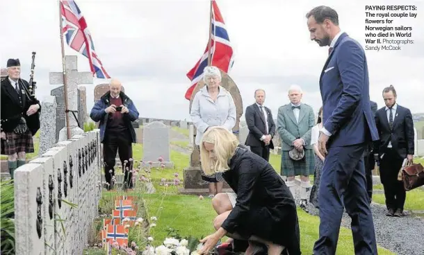  ?? Photograph­s: Sandy McCook ?? PAYING RESPECTS: The royal couple lay flowers for Norwegian sailors who died in World War II.