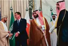  ?? AFP ?? US Secretary of Defence Ashton Carter greets Oman’s Defence Minister Sayyid Badr Saud Al Busaidi as Saudi Deputy Crown Prince and Defence Minister Mohammad Bin Salman and UAE Minister of State for Defence Affairs Mohammad Ahmad Al Bawardi look on in...