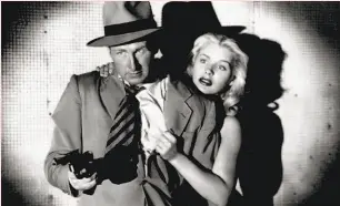  ?? Film Noir Foundation ?? Lloyd Bridges and Barbara Payton in “Trapped,” the 1949 thriller in which Bridges is a counterfei­ter working with and against the feds.