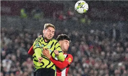  ?? Justin Tallis/AFP/Getty Images ?? Emile Smith Rowe (left) battles for a header with Brentford’s Aaron Hickey during Arsenal’s Carabao Cup win on Wednesday. Photograph: