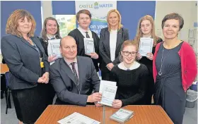  ??  ?? Presentati­on Seated, John Reynolds OBE, chief executive officer Castle Water, and Emma Forrest. Standing, head teacher Bev Leslie, Emily Hatton, Callum Dawson, Jeannine McVean (marketing officer at Castle Water), Ruth Daniell and Eleanor Rutherford,...