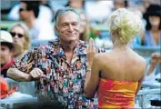  ?? Lori Shepler Los Angeles Times ?? THE JUNE 2001 Playboy Jazz Festival inspires Hugh Hefner and friend to dance at Hollywood Bowl.