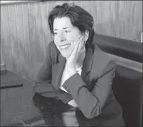  ?? Photo by Joseph B. Nadeau ?? Gov. Gina Raimondo listens as Alda Cooke talks about the challenges of being a small business owner in Woonsocket’s Main Street district.