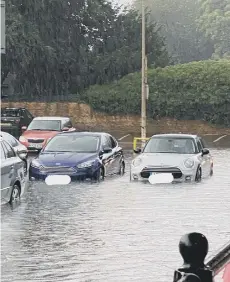  ??  ?? Car Haven car park was flooded, which meant a worrying time for motorists returning to their cars, captured in the photo by Gemma Devitt.