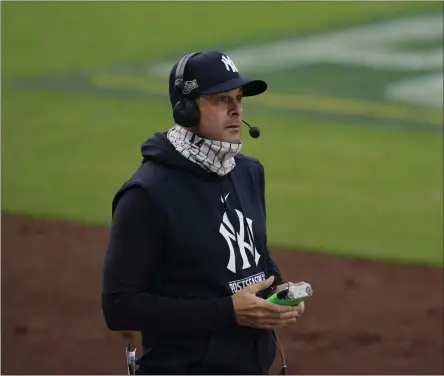  ?? GREGORY BULL ?? New York Yankees manager Aaron Boone takes part in a TV interview during a pause in Game 4of a baseball American League Division Series against the Tampa Bay Rays, Thursday, Oct. 8, 2020, in San Diego.