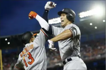  ?? PATRICK SEMANSKY — THE ASSOCIATED PRESS ?? Yankees outfielder Aaron Judge celebrates his solo home run with shortstop Manny Machado during the first inning of All-Star Game on July 17 in Washington.