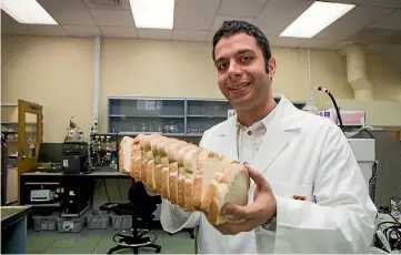  ?? PHOTO: DOMINICO ZAPATA/ STUFF ?? Dr Aydin Berenjian is taking unsold bread and putting it through a fermentati­on process to create a new loaf.