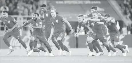  ??  ?? The England players celebrate their victory over Colombia.