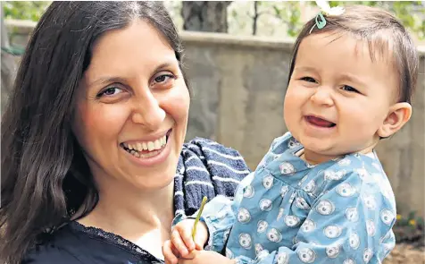  ??  ?? Nazanin Zagharirat­cliffe, pictured with her daughter Gabriella. Left, Richard Ratcliffe, her husband, says she will ‘definitely’ soon be freed from jail in Iran