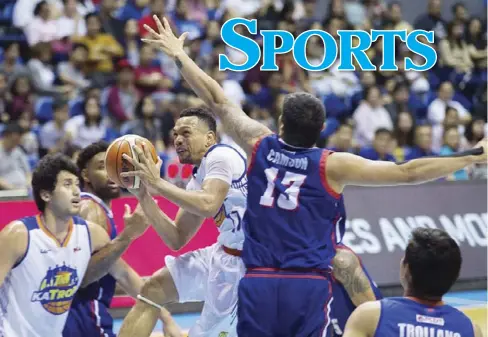  ?? NOEL TONIDO / TIEBREAKER TIMES ?? Jayson Castro of TNT KaTropa struggles past the defense of Columbian Dyip.