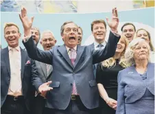 ?? PETER SUMMERS/GETTY IMAGES ?? Nigel Farage celebrates the results with other Brexit Party MEPs