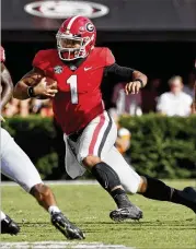  ?? BOB ANDRES / BANDRES@AJC.COM ?? Bulldogs backup quarterbac­k Justin Fields was said to be the target of racially-insensitiv­e language that allegedly came from a UGA baseball player at Saturday’s game against Tennessee.