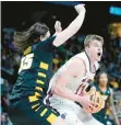  ?? JOHN MINCHILLO/AP ?? St. Mary’s Mitchell Saxen looks to pass against Virginia Commonweal­th’s David Shriver in the second half Friday in Albany, New York.