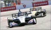  ?? JASON BEHNKEN - THE ASSOCIATED PRESS ?? Graham Rahal (15) races into turn two before finishing second in the IndyCar Firestone Grand Prix of St. Petersburg Sunday, March 11, 2018, in St. Petersburg, Fla.