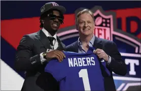  ?? JEFF ROBERSON — THE ASSOCIATED PRESS ?? LSU wide receiver Malik Nabers, left, poses with NFL Commission­er Roger Goodell after being chosen by the Giants with the sixth overall pick during the first round of the NFL Draft on Thursday in Detroit.