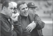  ?? FILE — THE ASSOCIATED PRESS ?? In this file photo, Navy head coach Rick Forzano, left, and Notre Dame head coach Ara Parseghian talk on the sideline during a football game in Philadelph­ia. Notre Dame defeated Navy 56-7. Parseghian died Wednesday at his home in Granger, Ind. he was 94.