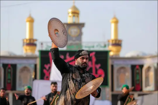  ?? (AP/Anmar Khalil) ?? Iraqi Shiites take part in Ashoura on Monday in Karbala, Iraq.