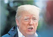  ?? [AP PHOTO] ?? President Donald Trump answers a question from a member of the media as he leaves the White House on Saturday in Washington, en route to see fire damage in California.