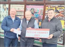  ?? ?? Jimmy Corcoran and Noel McCarthy pictured with Denis O’Riordan of the Mostly Just €2 Fermoy who sponsored the lights this week.