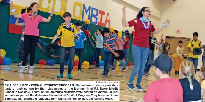  ?? Palliser Schools photo ?? PALLISER INTERNATIO­NAL STUDENT PROGRAM: Colombian students provide a taste of their culture for their classmates of the last month at R.I. Baker Middle School in Coaldale. A total of 30 Colombian students were hosted by various Palliser schools as part of the division's Internatio­nal Student Program. They leave for home Saturday, with a group of students from China the next to visit, this coming week.