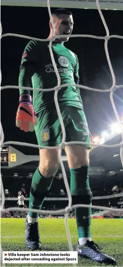  ??  ?? >
Villa keeper Sam Johnstone looks dejected after conceding against Spurs