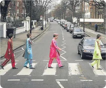  ??  ?? Traffic is regularly held up by Beatles impersonat­ors on the most famous UK crossing.