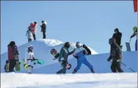  ?? SHA DADI / XINHUA ?? Skiers hit the slopes at Jiangjunsh­an Ski Resort in Altay in the Xinjiang Uygur autonomous region.