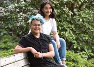  ?? The Canadian Press ?? Joshua Ramon and Stephanie Barrantes, both Grade 12 students, are helping Grade 7 students in a pilot project called Here 4 Peers.