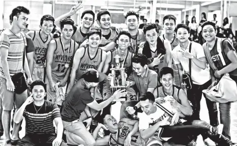 ?? JESSIE HENRY CASTILLO ?? BACK-TO-BACK. The Golden Wyverns players celebrate their trophy after winning their back-to-back championsh­ip title in the Davao Doctors College (DDC) 2017 Intramural­s college basketball tournament held at the DDC Basketball covered court recently.