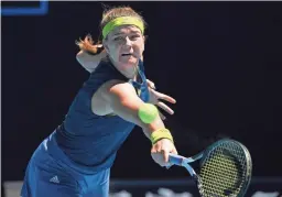  ?? ANDY BROWNBILL/AP ?? Karolina Muchova hits a backhand return to Ash Barty during their Australian Open quarterfin­al Wednesday in Melbourne.