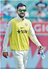  ?? — PTI ?? Virat kohli carries drinks for Team India.