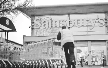  ??  ?? Sainsbury’s said on Monday it would buy Asda, owned by Walmart for around 7.3 billion pounds, in a bold attempt to overtake longtime leader Tesco as Britain’s biggest supermarke­t group by market share. — AFP photo