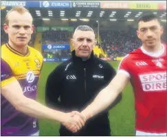  ?? (Pic: George Hatchell) ?? Captains, Simon Donohoe, Wexford and Sean O’Donoghue, Cork, with referee Liam Gordan, Galway, before the Allianz Hurling League Div 1A tie at Chadwicks Wexford Park.