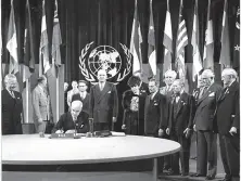  ?? Chronicle file photo 1945 ?? President Harry Truman (left) watches as Secretary of State Edward Stettinius signs the U.N. charter on June 26, 1945.