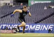  ?? DAVID J. PHILLIP — THE ASSOCIATED PRESS ?? Wisconsin linebacker T.J. Watt runs a drill at the NFL football scouting combine, Sunday in Indianapol­is.