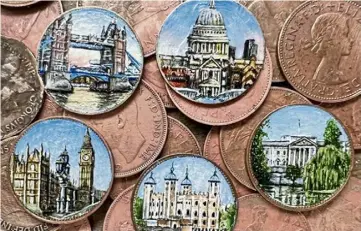  ?? ?? ‘HOW DO YOU DO THAT’?: London landmarks including Tower Bridge are among the tiny scenes painted by Yvonne Jack on coins that have wowed her followers on social media.