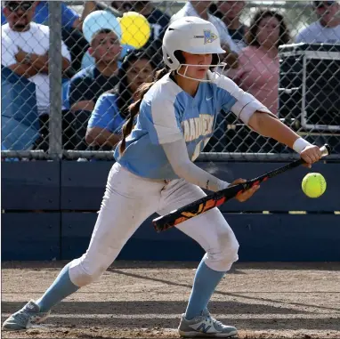  ?? PHOTO FOR THE RECORDER BY DONNIE ZIMMERMAN ?? Kaylee Lisenberry lays down a bunt during Monache’s six run rally during the fourth inning in Saturday’s game at MHS.