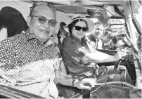  ??  ?? OFF-ROAD EXPERIENCE: Christina and ministry permanent secretary Datuk Datu Rosmadi Datu Sulai getting a feel of a high-powered 4x4 vehicle during the flag-off of the Borneo Safari here yesterday.