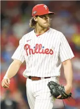  ?? TIM NWACHUKWU/GETTY ?? Aaron Nola exits the game in the fifth inning against the Diamondbac­ks in Game 6 of the NLCS on Monday in Philadelph­ia.