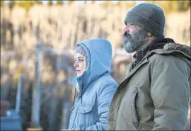  ?? David Bukach Netf lix ?? RILEY KEOUGH plays a grieving mother and Jeffrey Wright is an outsider who bears witness to the mystery that unfolds in the Netflix film “Hold the Dark.”