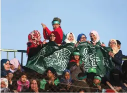  ?? (Reuters) ?? PALESTINIA­NS TAKE PART in a rally marking the 29th anniversar­y of the Hamas movement last December in Rafah, in the southern Gaza Strip.