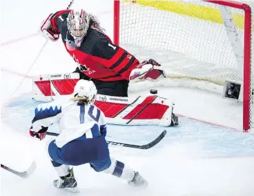  ?? — THE CANADIAN ?? Brianna Decker of the U.S. scores on Canada’s Shannon Szabados during Saturday’s Four Nations Cup gold-medal game in Saskatoon. The U.S. won, 5-2.