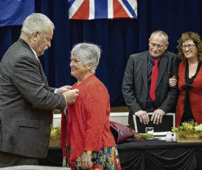  ?? PHOTO: SUPPLIED ?? Work recognised . . . Southland District Mayor Gary Tong presents Southlande­r Ann Robbie with a Queen’s Service Medal for services to historical research, on behalf of King Charles III, at a special ceremony at the Winton Memorial Hall last Friday.